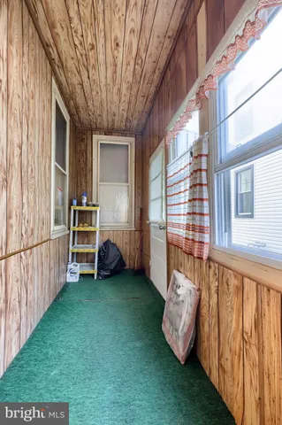 a view of a backyard with sitting area and garden