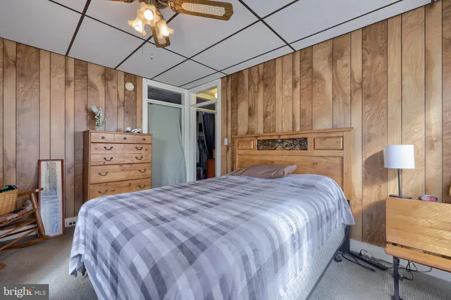 a bedroom with a bed and a table