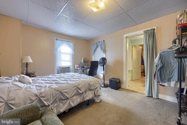 a bedroom with a bed and a lamp