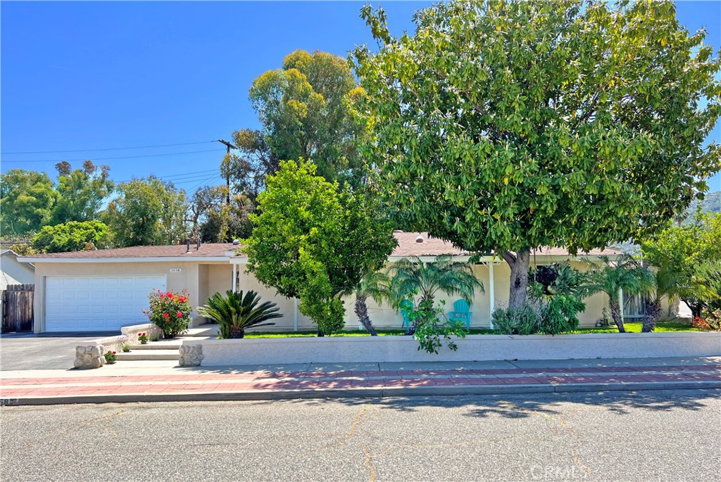 a view of a house with a street