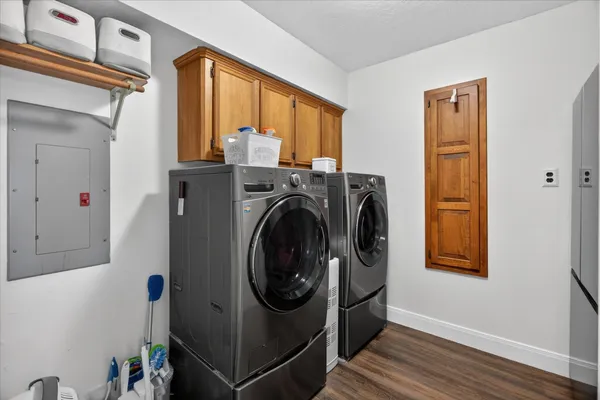 a view of a hallway with washer and dryer