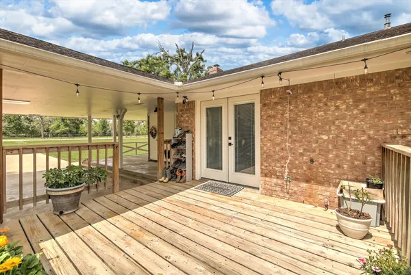 a outdoor space with lots of furniture and wooden floor