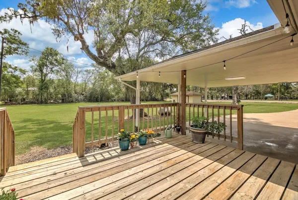 a view of a balcony with wooden floor
