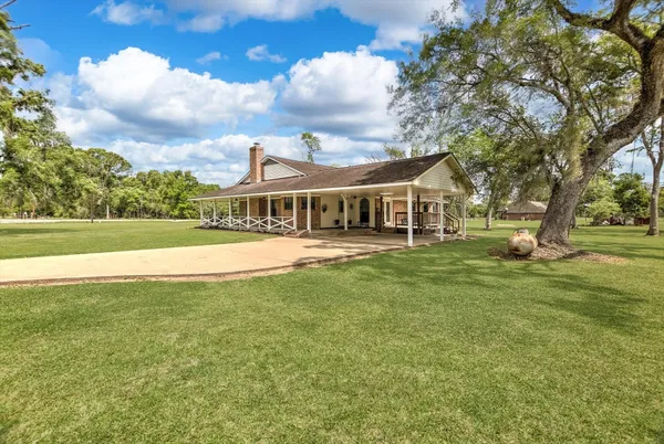 a view of a house with a big yard