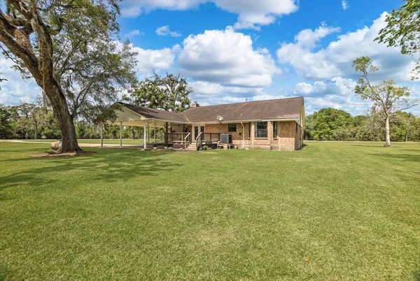 a view of a house with a big yard