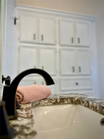 a bathroom with a bathtub and sink