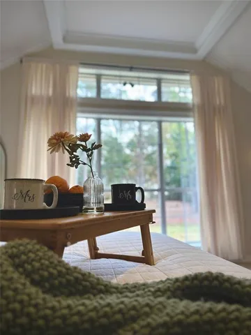a view of a living room and floor to ceiling window