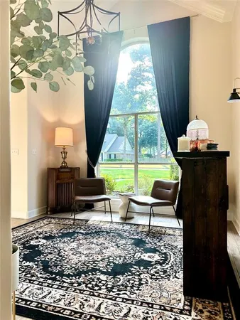 a bedroom with a bed and a lamp with window