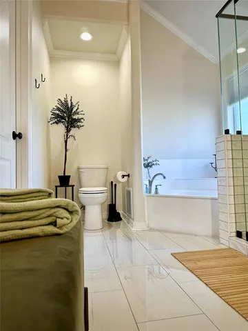 a view of a bathroom with a tub and a shower