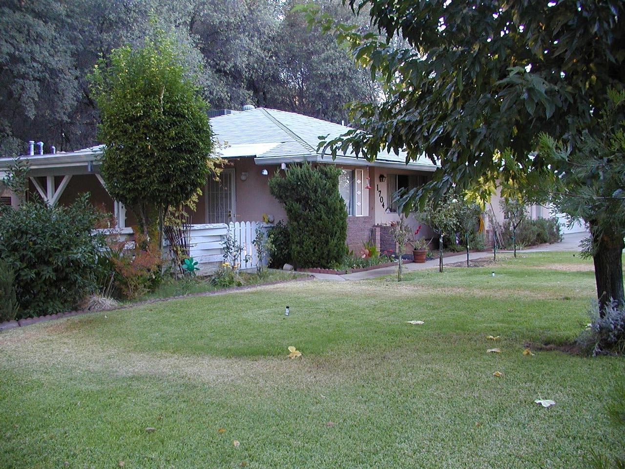 1704 Canyon Road Redding, CA 96001 - Photo 1 of 7 a front view of a house with a yard