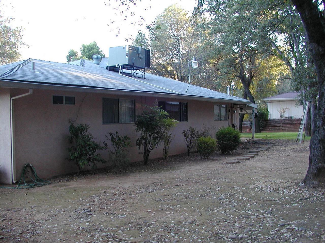 1704 Canyon Road Redding, CA 96001 - Photo 4 of 7 a view of a house with a garden