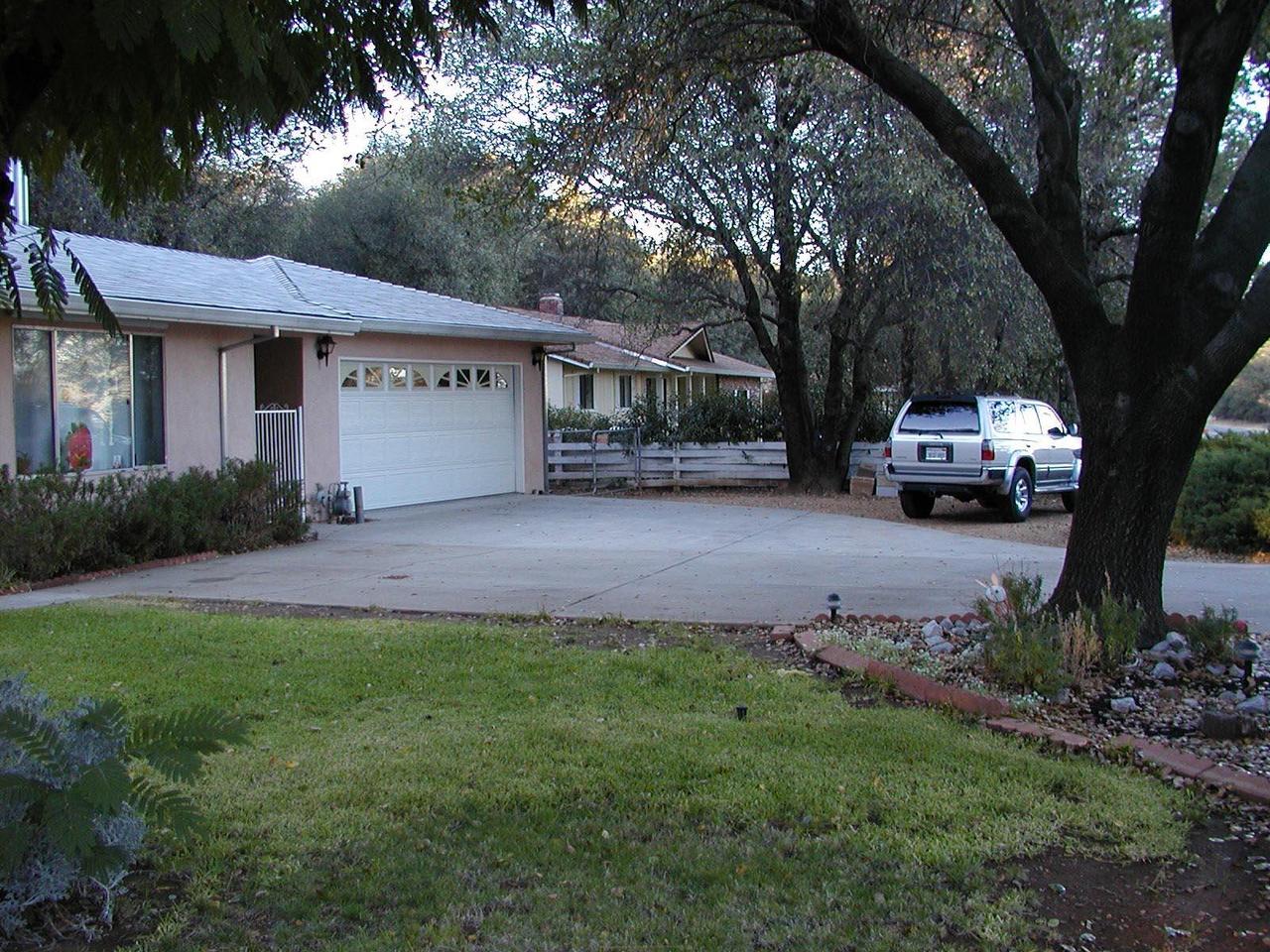 1704 Canyon Road Redding, CA 96001 - Photo 5 of 7 a view of a car in front of house