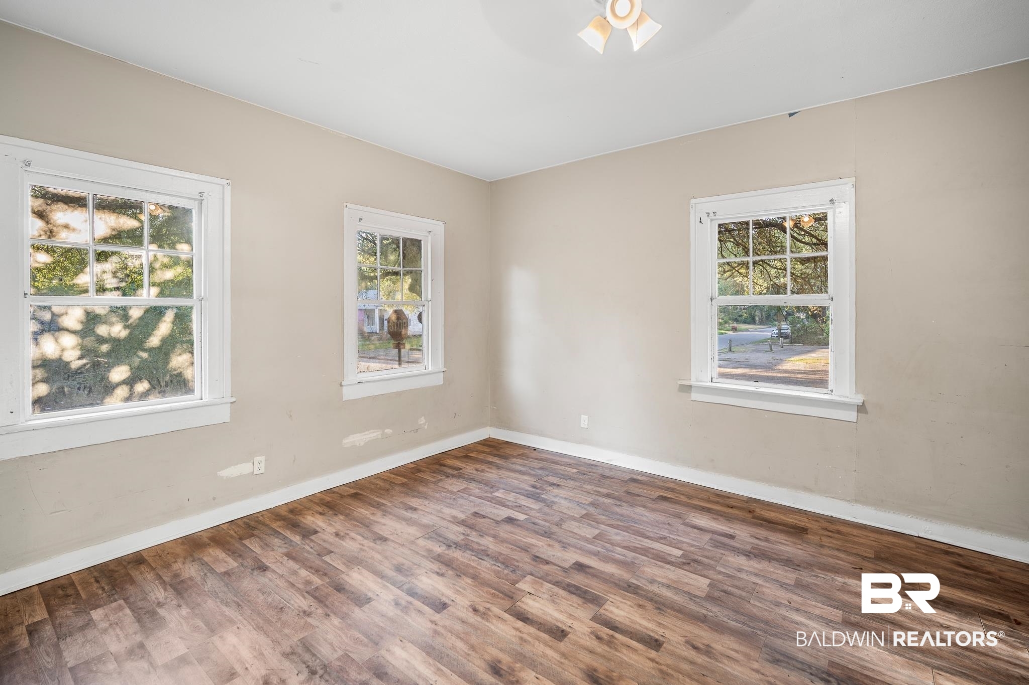 401 Gaston Street Mobile, AL 36603 - Photo 5 of 17 Empty room with ceiling fan and hardwood / wood-style floors. Could be used as 5th bedroom.