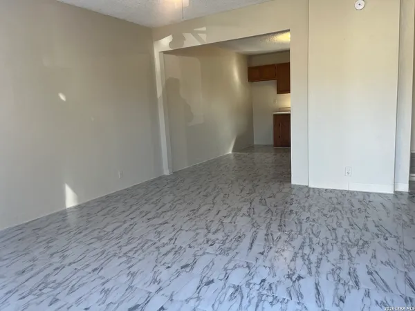 a view of hallway with wooden floor