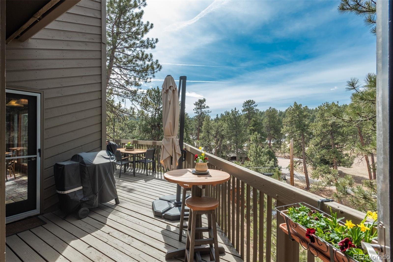 4192 Timbervale Drive Evergreen, CO 80439 - Photo 18 of 50 a view of a outdoor sitting area with furniture