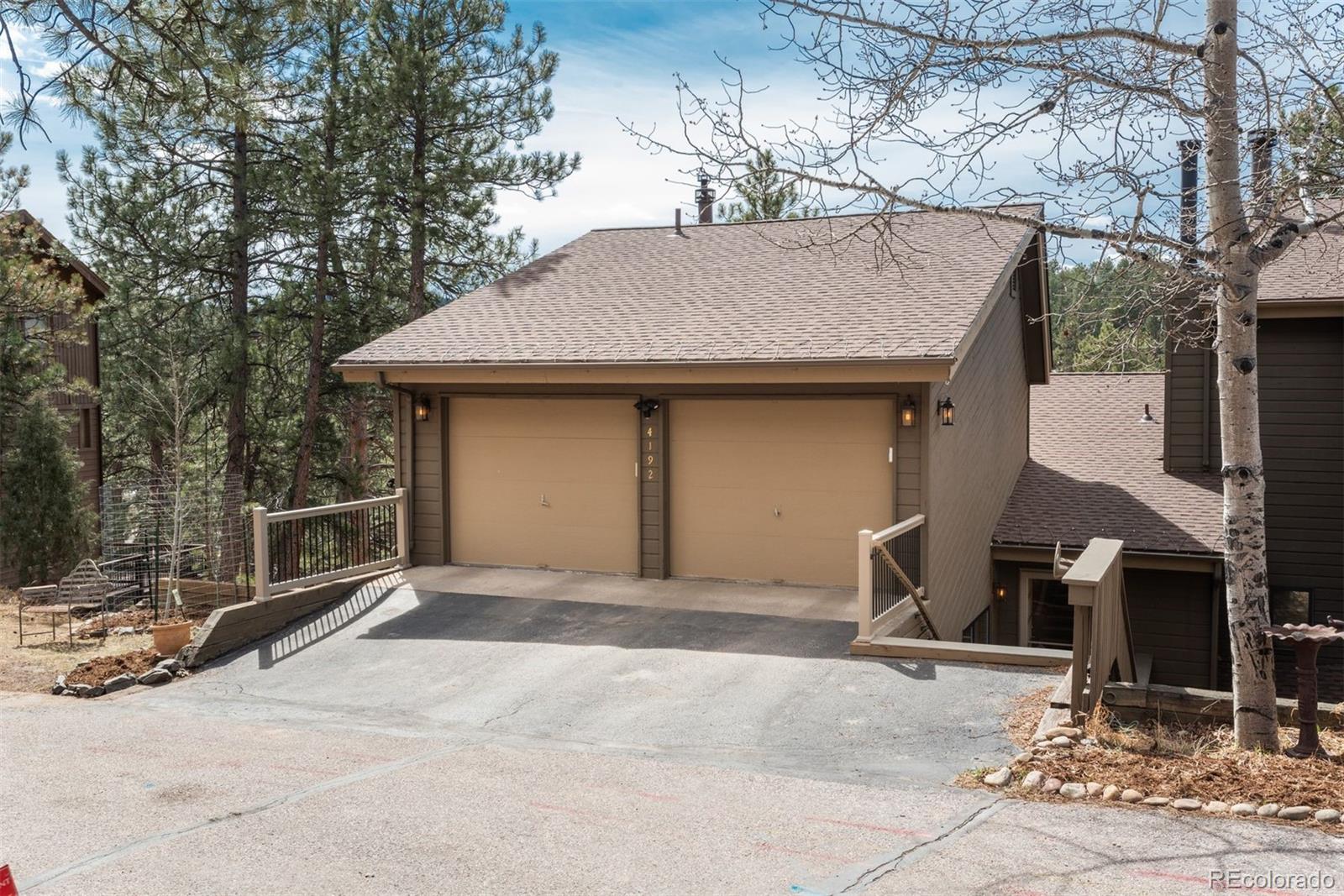 4192 Timbervale Drive Evergreen, CO 80439 - Photo 2 of 50 a front view of a house with yard