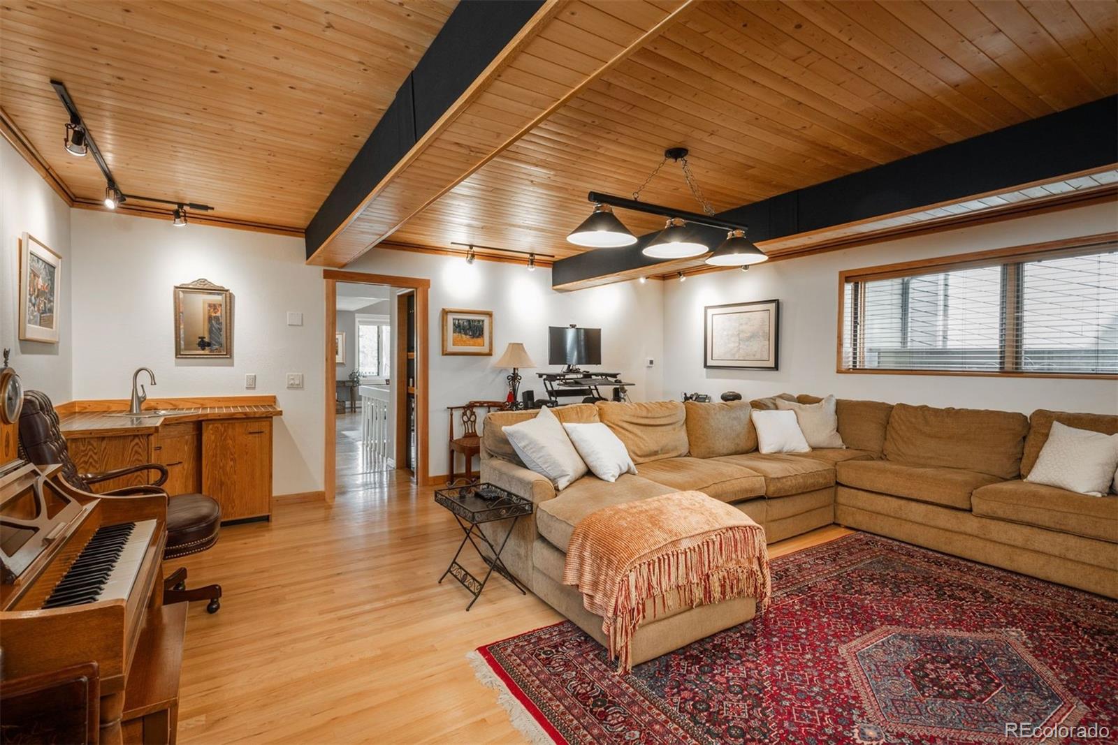 4192 Timbervale Drive Evergreen, CO 80439 - Photo 21 of 50 a living room with furniture wooden floor and a table