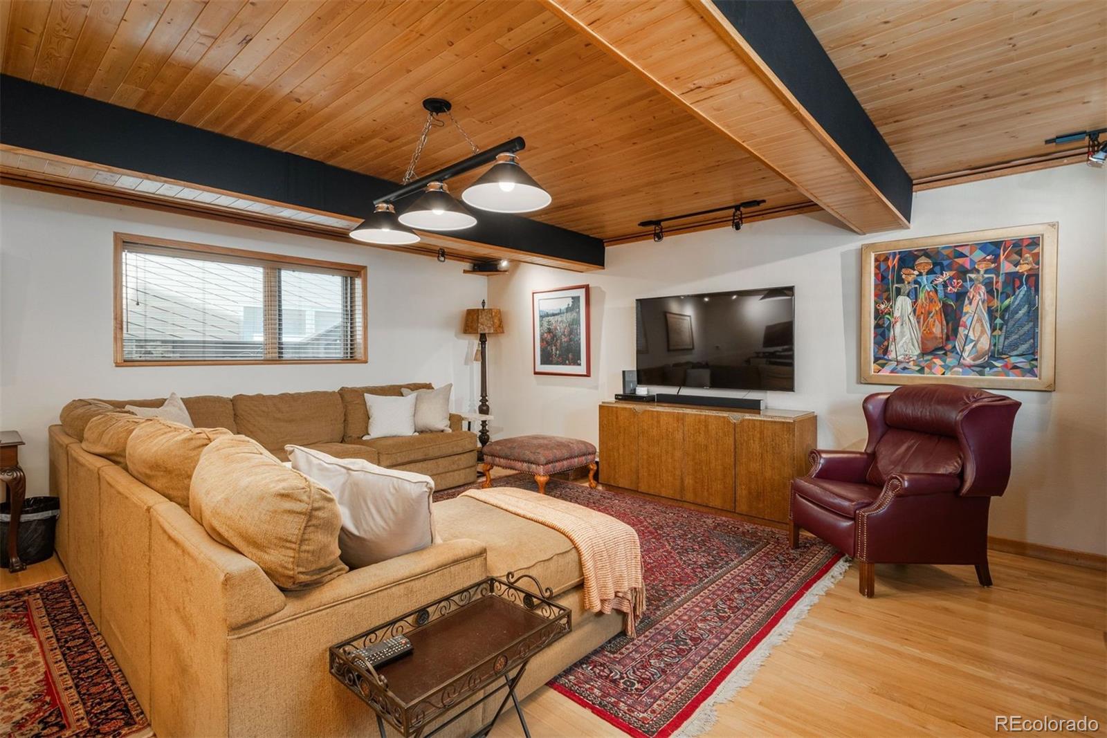 4192 Timbervale Drive Evergreen, CO 80439 - Photo 22 of 50 a living room with furniture and a flat screen tv