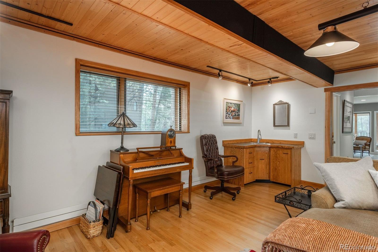 4192 Timbervale Drive Evergreen, CO 80439 - Photo 23 of 50 a livingroom with workspace and a window