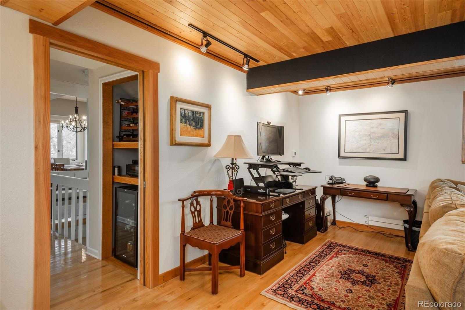 4192 Timbervale Drive Evergreen, CO 80439 - Photo 24 of 50 a view of a workspace with furniture and a livingroom