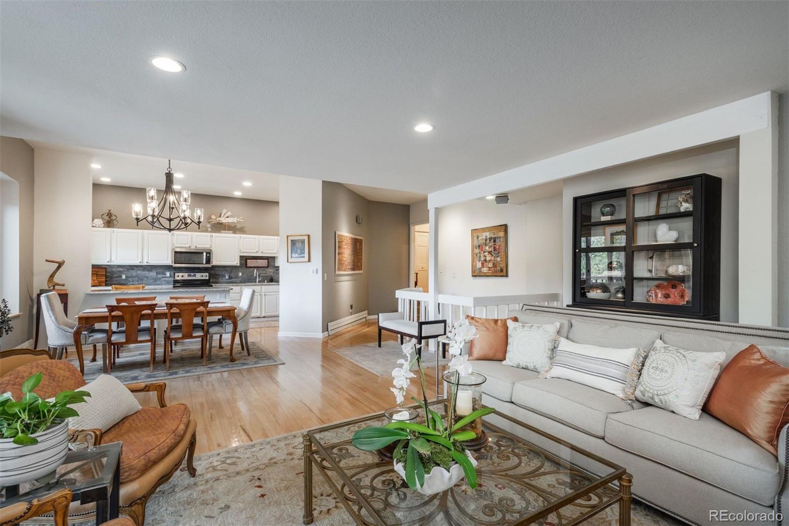 4192 Timbervale Drive Evergreen, CO 80439 - Photo 26 of 50 a living room with furniture and a kitchen view
