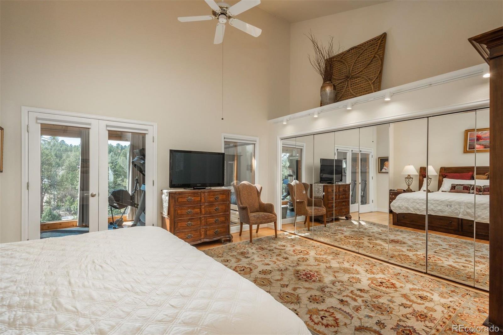 4192 Timbervale Drive Evergreen, CO 80439 - Photo 28 of 50 a bedroom with furniture and large window