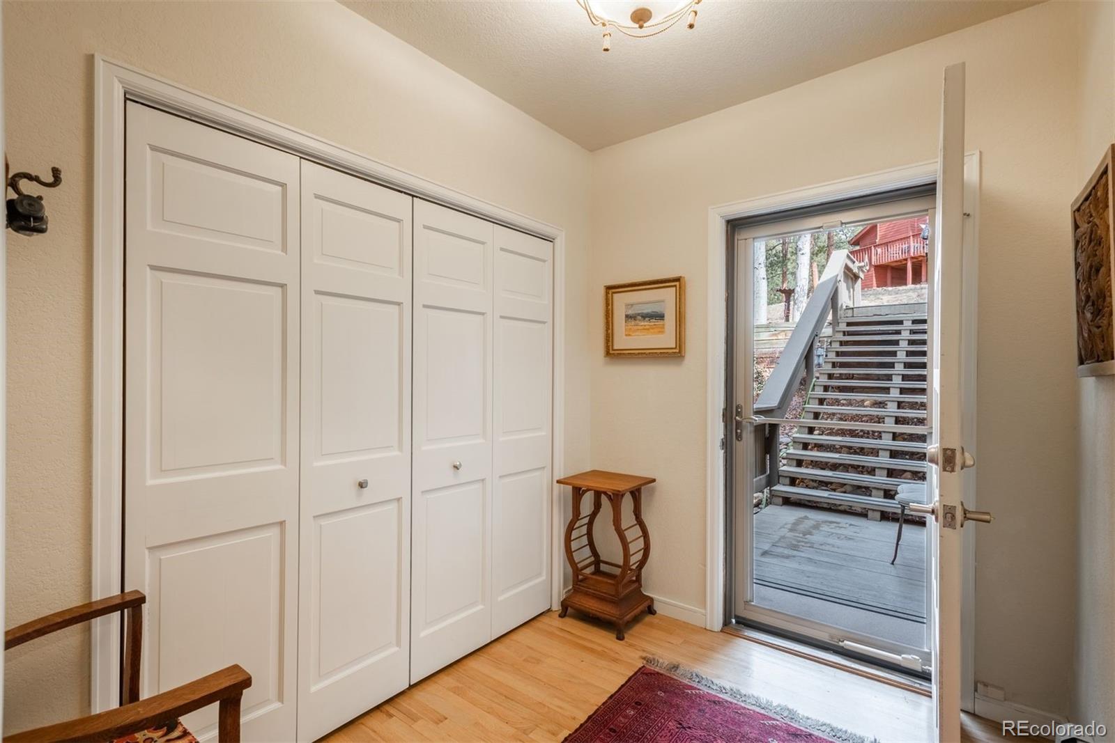 4192 Timbervale Drive Evergreen, CO 80439 - Photo 3 of 50 a view of a hallway with closet