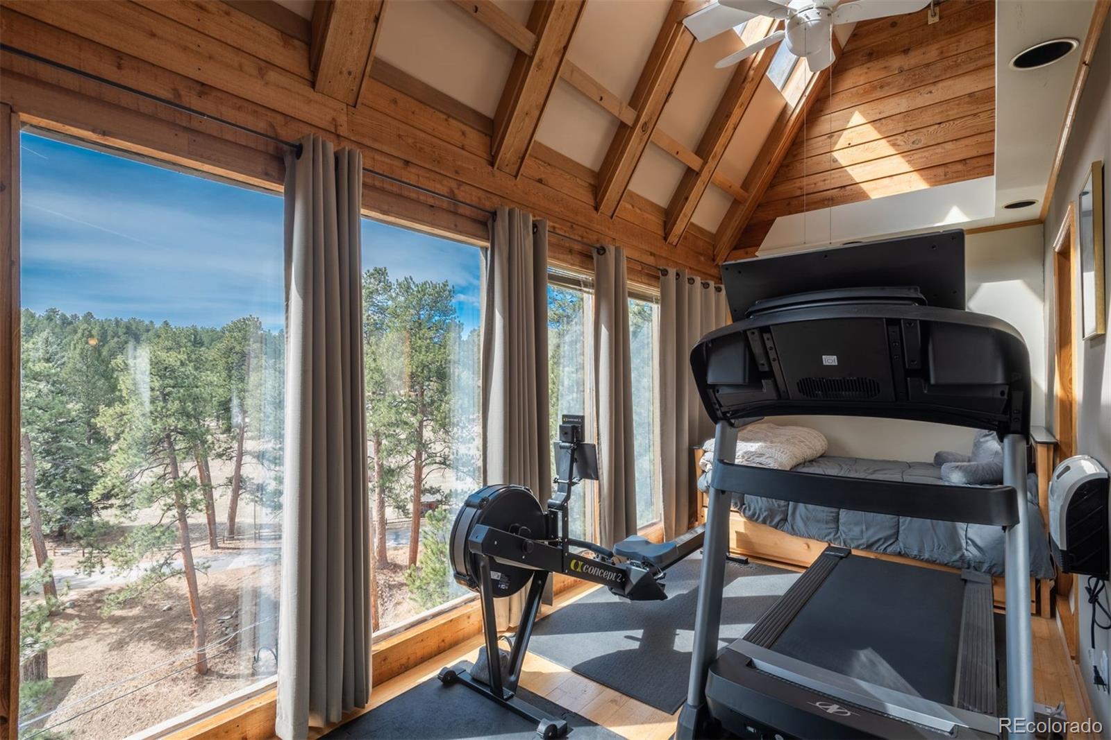 4192 Timbervale Drive Evergreen, CO 80439 - Photo 31 of 50 a view of a porch with furniture and a gate