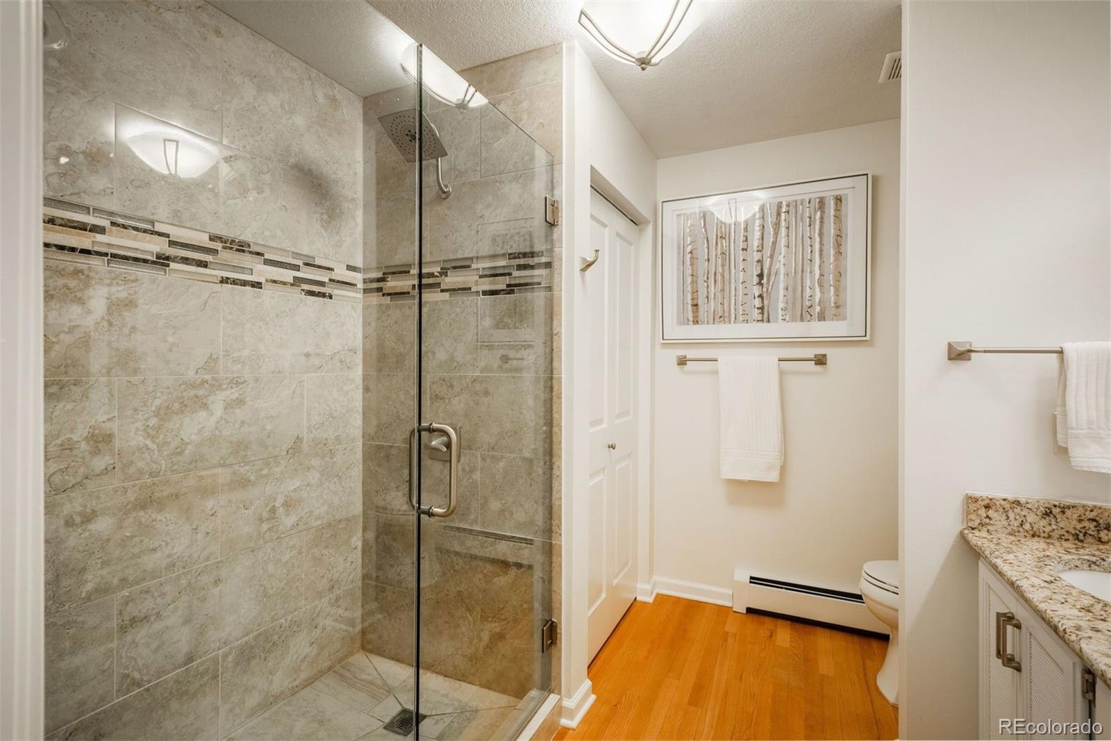 4192 Timbervale Drive Evergreen, CO 80439 - Photo 34 of 50 a bathroom with a tub and a shower