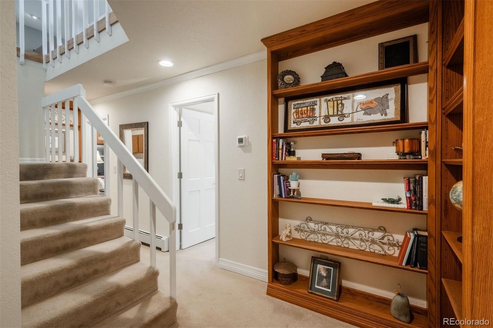 4192 Timbervale Drive Evergreen, CO 80439 - Photo 35 of 50 a view of staircase with white walls and a window