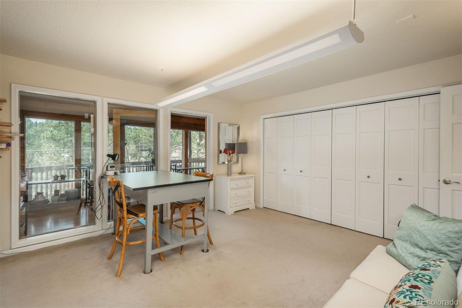 4192 Timbervale Drive Evergreen, CO 80439 - Photo 42 of 50 a dining room with furniture and window