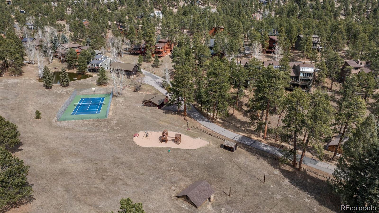 4192 Timbervale Drive Evergreen, CO 80439 - Photo 49 of 50 an aerial view of a house with a yard