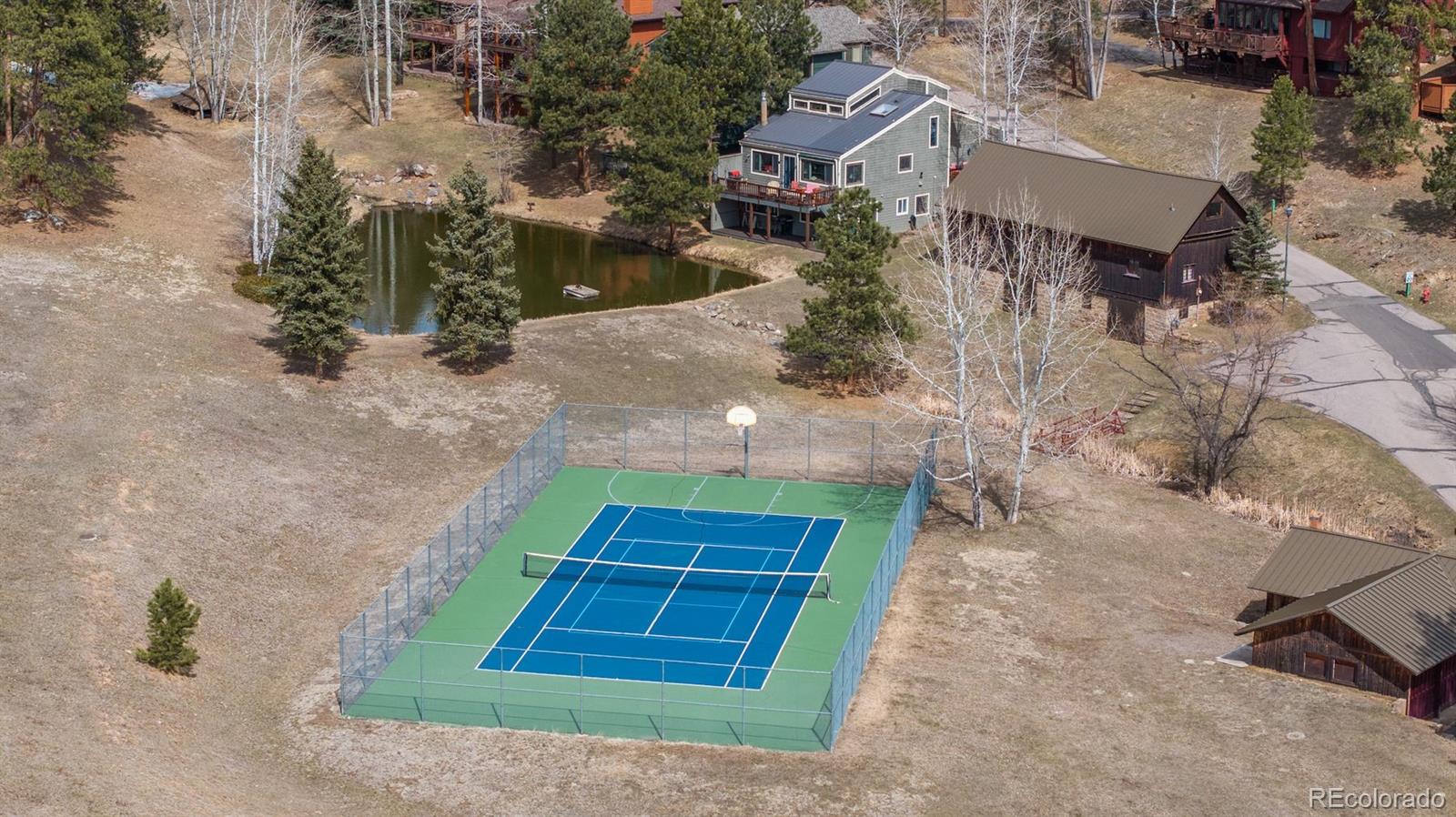 4192 Timbervale Drive Evergreen, CO 80439 - Photo 50 of 50 an aerial view of a house with a yard
