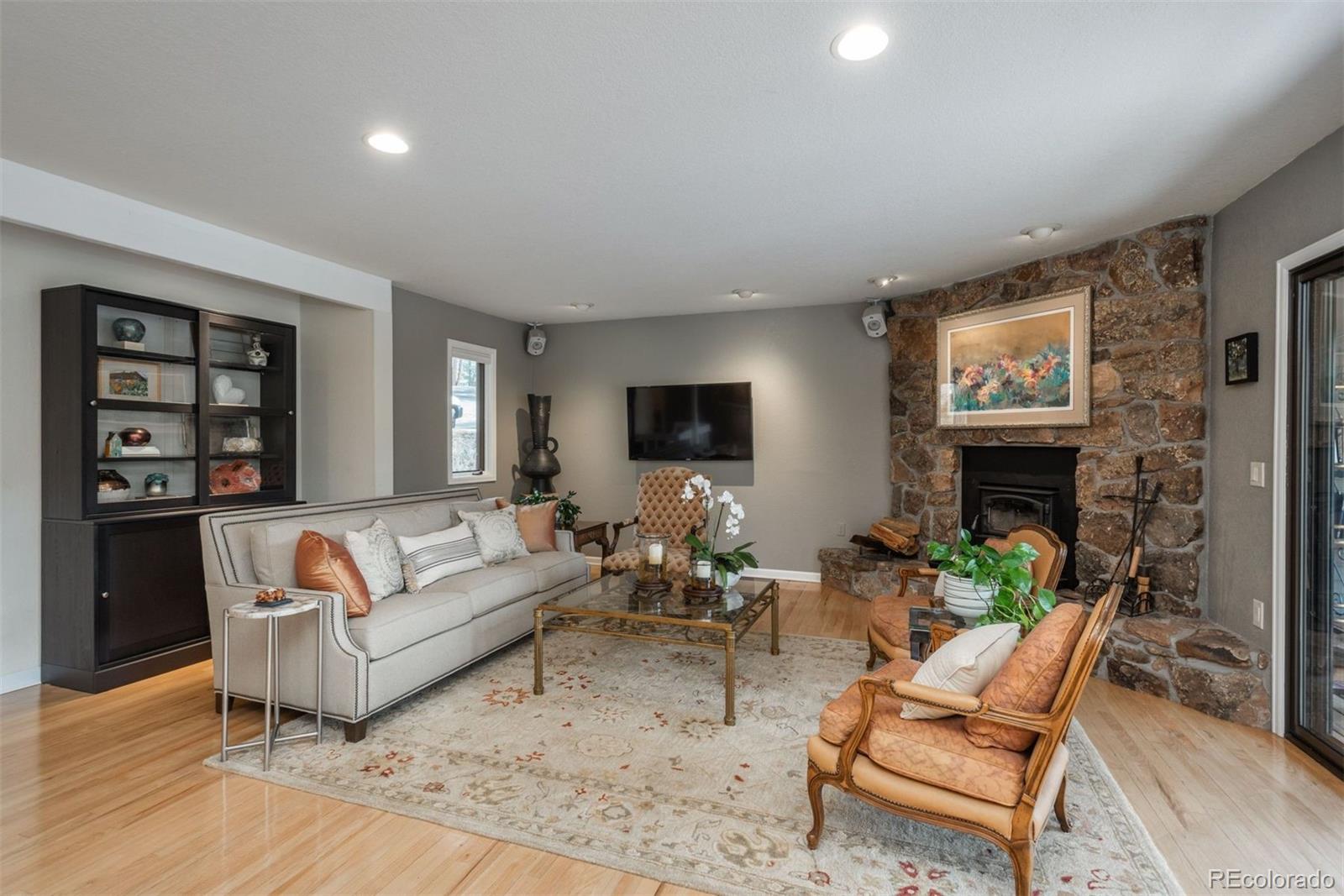 4192 Timbervale Drive Evergreen, CO 80439 - Photo 6 of 50 a living room with furniture and a fireplace