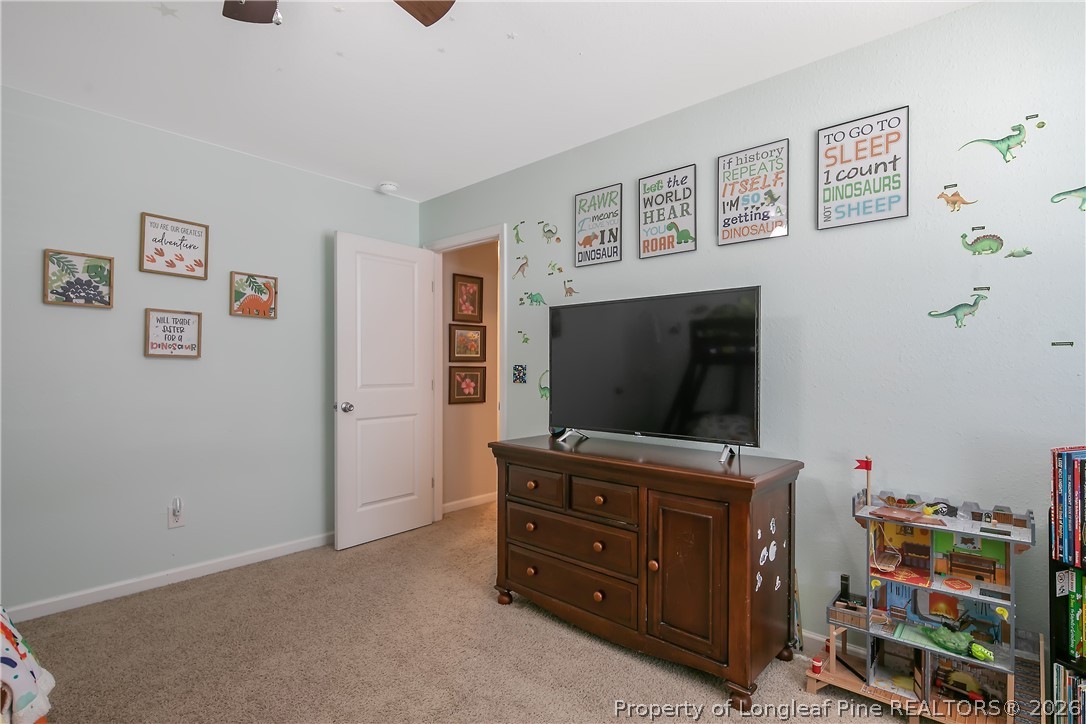 340 Battery Way Bunnlevel, NC 28323 - Photo 35 of 50 a living room with furniture and flat screen tv