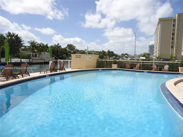 a view of a swimming pool and a chairs