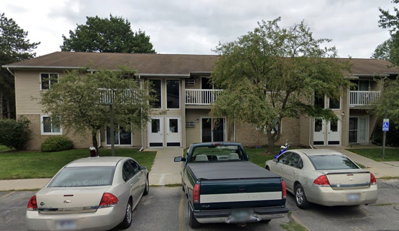 125 West Harrington Road Croswell, MI 48422 - Photo 1 of 11 a front view of a house with cars parked