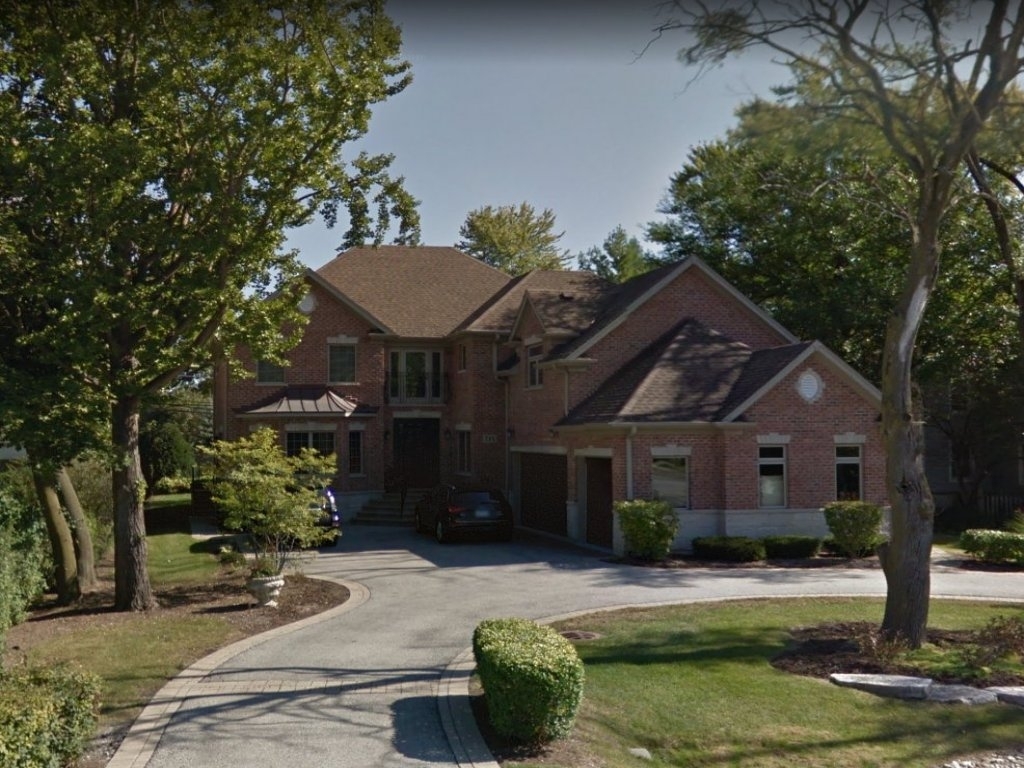713 Greenwood Road Glenview, IL 60025 - Photo 1 of 11 a front view of a house with garden