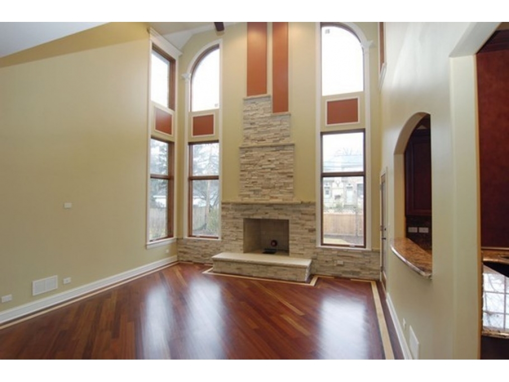 713 Greenwood Road Glenview, IL 60025 - Photo 2 of 11 a view of an empty room with a fireplace and a window