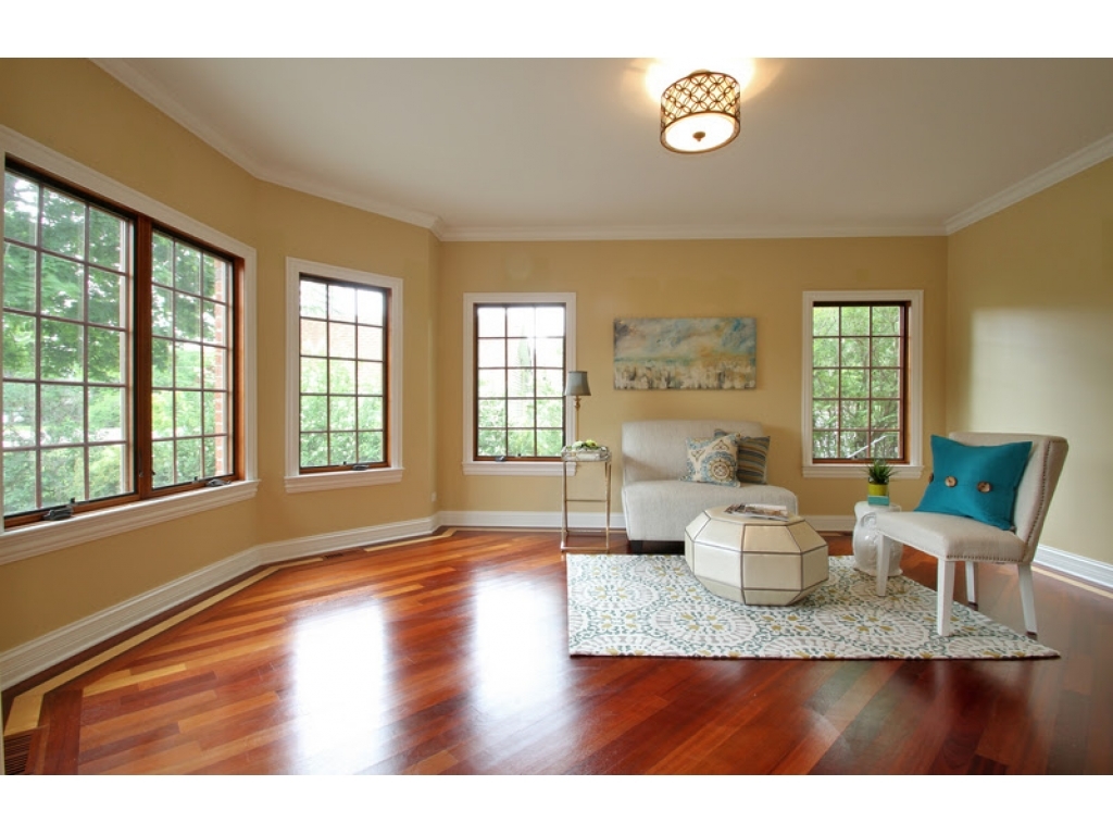 713 Greenwood Road Glenview, IL 60025 - Photo 3 of 11 a view of a dining room with furniture a potted plant and wooden floor