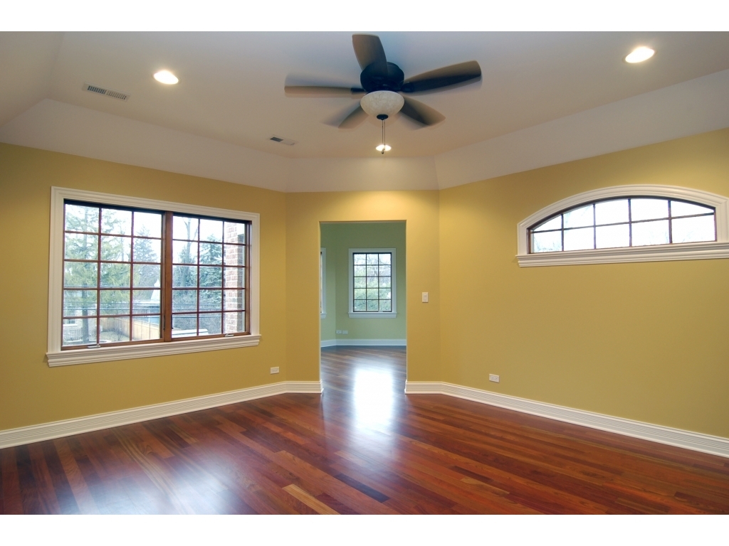 713 Greenwood Road Glenview, IL 60025 - Photo 6 of 11 a view of an empty room with a window and wooden floor