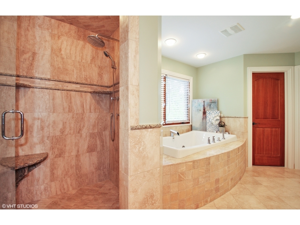 713 Greenwood Road Glenview, IL 60025 - Photo 7 of 11 a bathroom with a sink a mirror and a shower