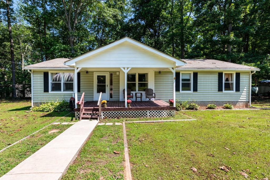 222 Coltrane Road Dawsonville, GA 30534 - Photo 1 of 1 a view of a house with a yard patio and a patio