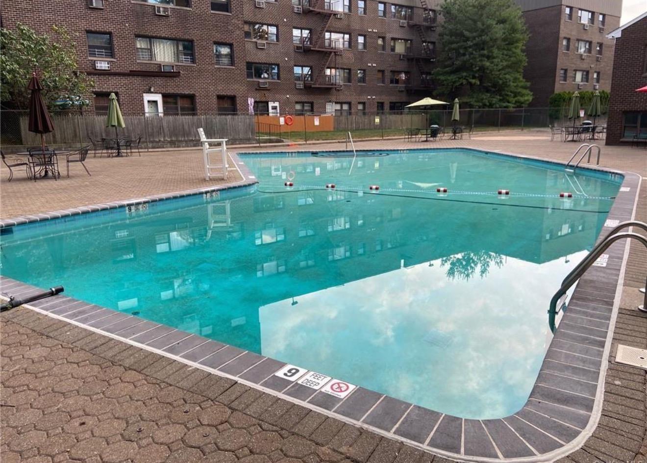 2261 Palmer Avenue, Unit 2A New Rochelle, NY 10801 - Photo 12 of 12 a view of a swimming pool with a patio