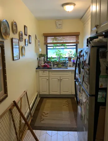 a kitchen with stove and cabinets