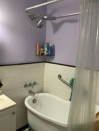 a bathroom with a sink and a shower curtain