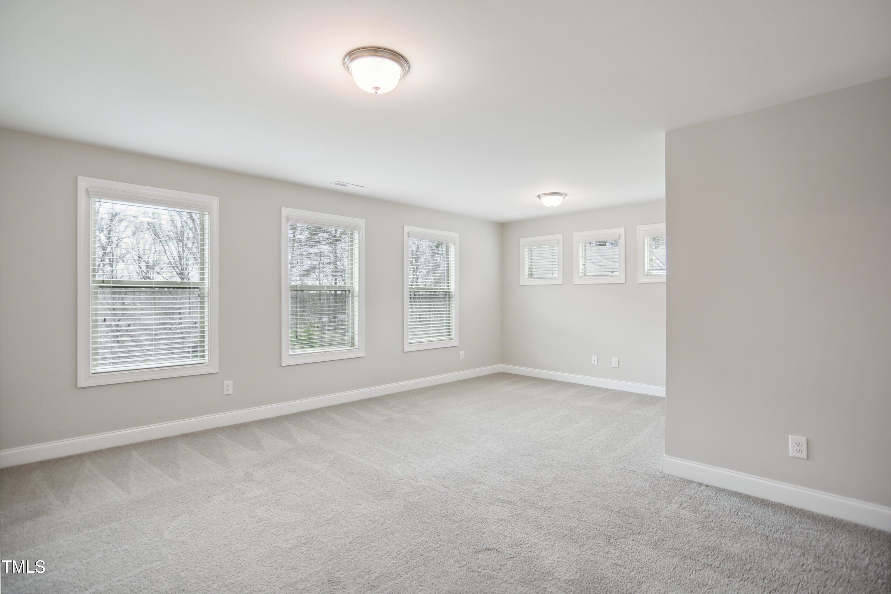1015 Rexburg Drive Cary, NC 27513 - Photo 12 of 29 an empty room with windows