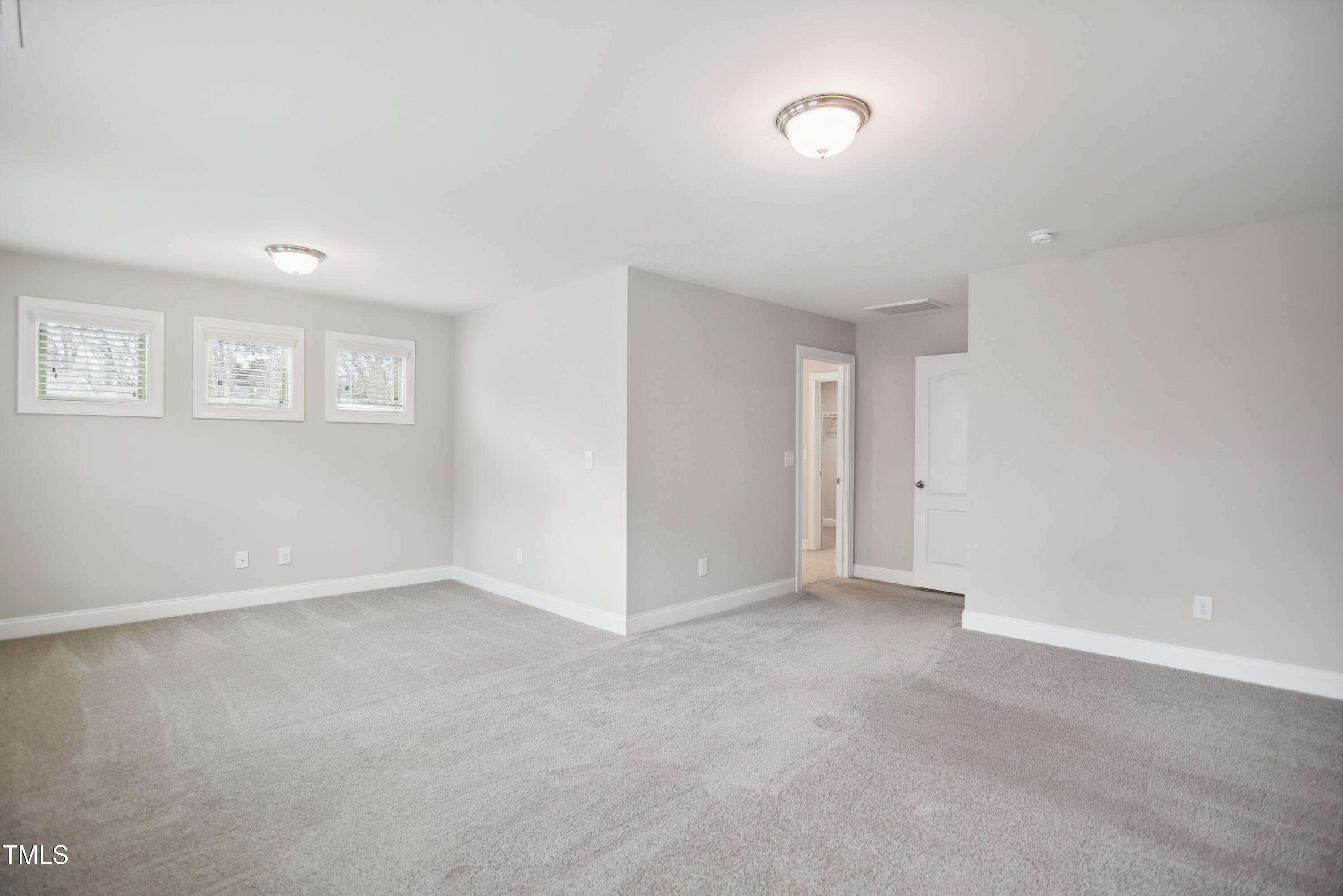 1015 Rexburg Drive Cary, NC 27513 - Photo 13 of 29 a view of an empty room with a window