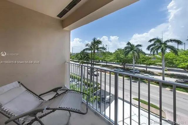 a view of balcony with potted plants