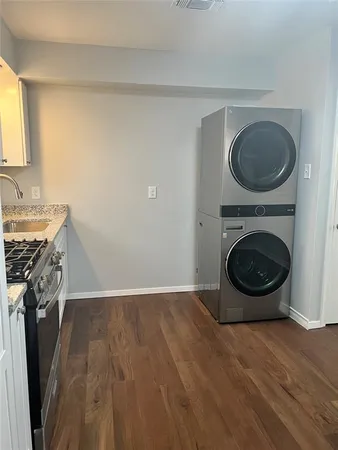 a view of a kitchen with washer and dryer